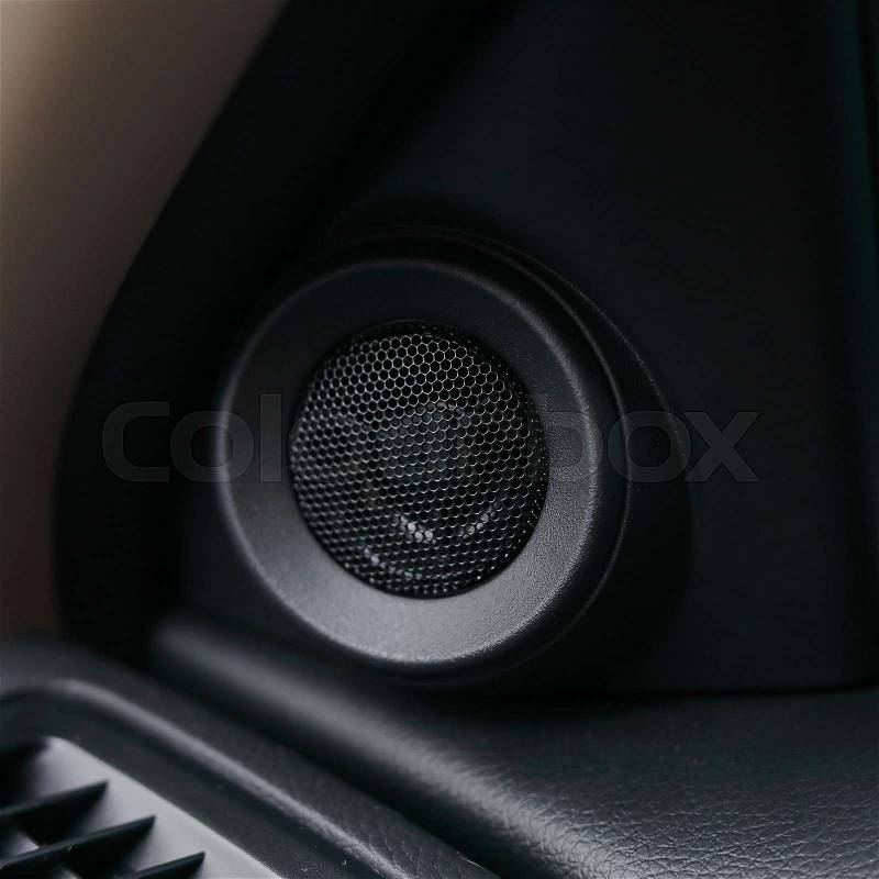 Small loudspeaker stereo music audio in modern car, stock photo