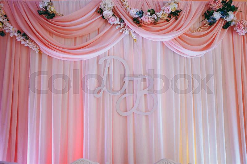 Original wedding floral decoration in the form of mini-vases and bouquets of flowers hanging from the ceiling, stock photo