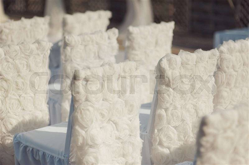 Decoration of chairs at the wedding. Beautiful chairs with decorations, stock photo