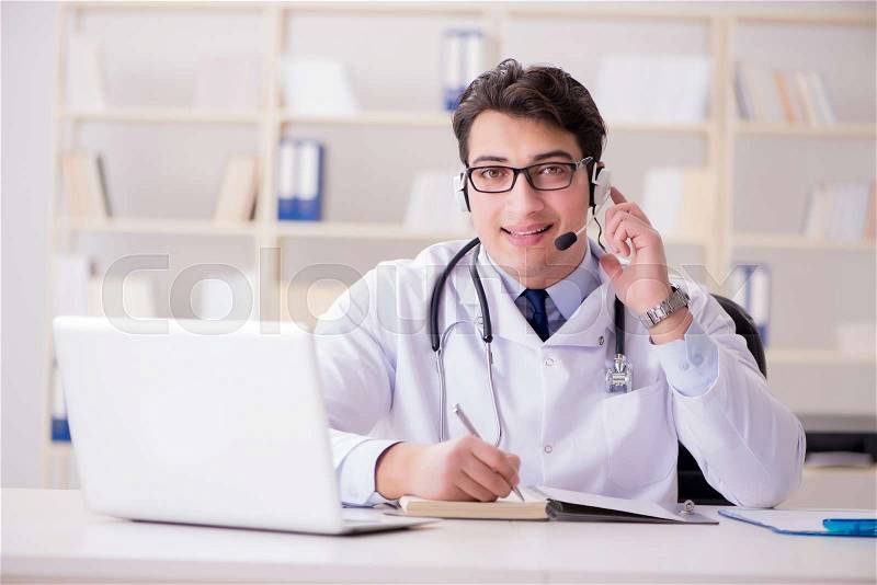 Young man doctor in medical concept, stock photo