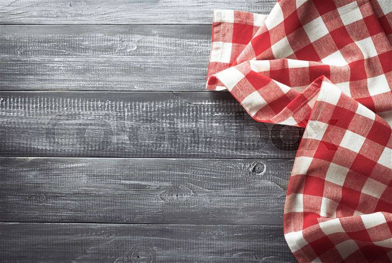 Cloth napkin on wooden background, stock photo