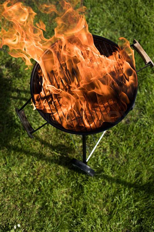 Barbecue grill with fire on nature, outdoor, close up, stock photo