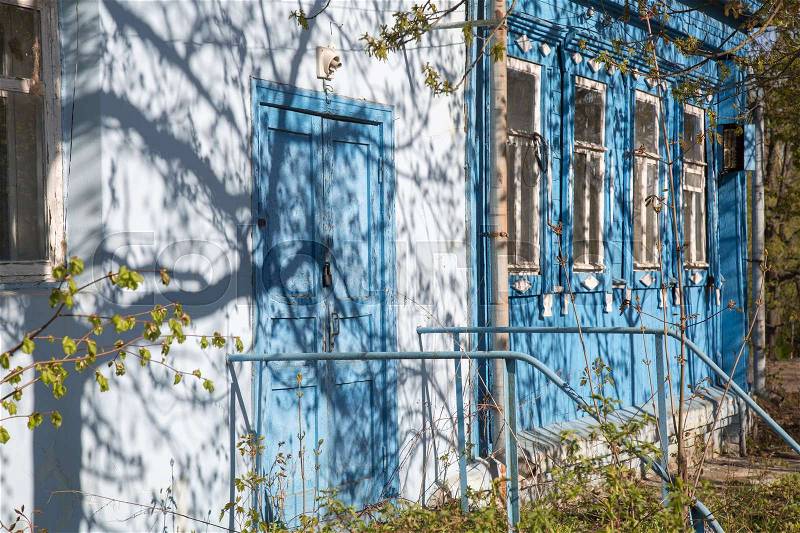 Vintage wooden house windows sunshine background blue white , stock photo