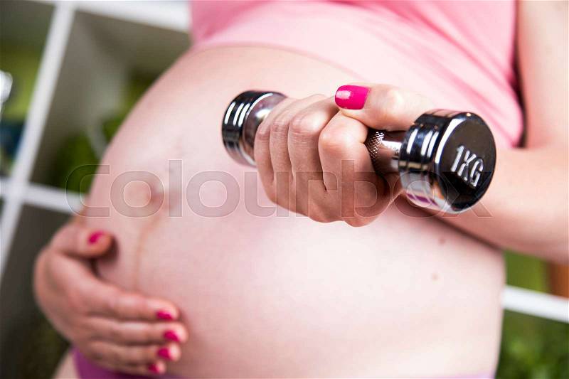 Fitness Pregnancy woman, healthy lifestyle concept, stock photo