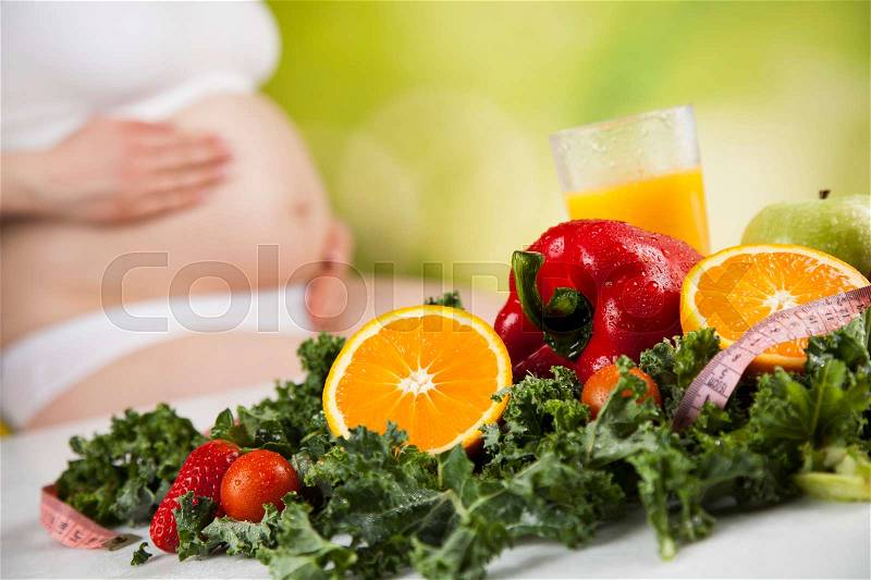 Pregnancy, sport, fitness, healthy lifestyle concept, stock photo