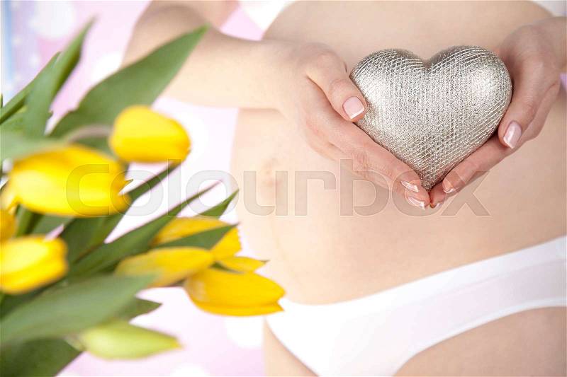 Heart, Beautiful Pregnant Woman belly, stock photo