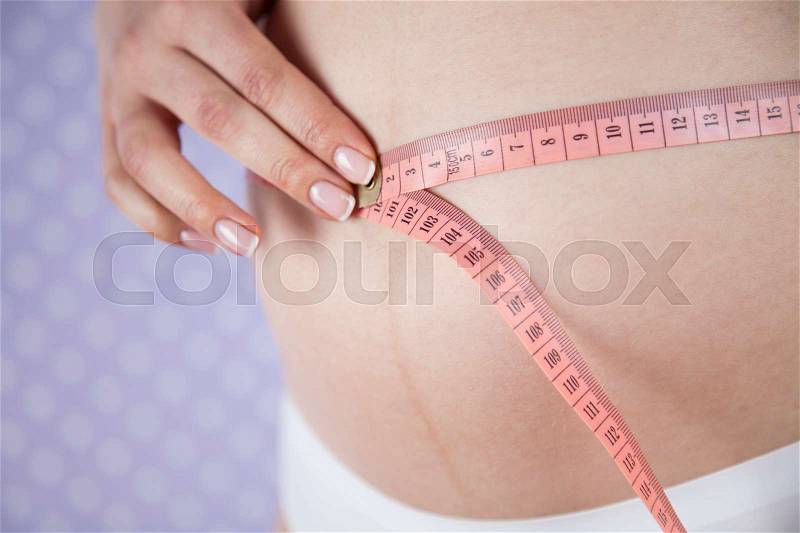 Measure tape, Pregnancy woman, healthy lifestyle concept, stock photo