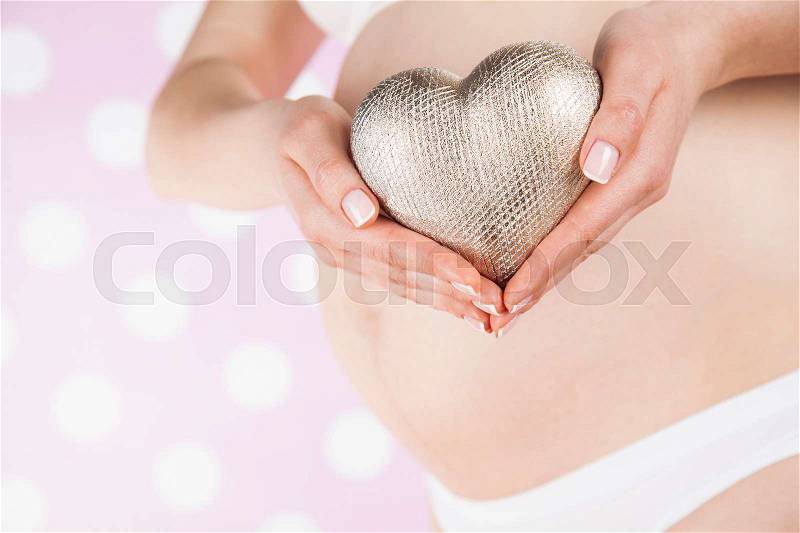 Heart, Beautiful Pregnant Woman belly, stock photo
