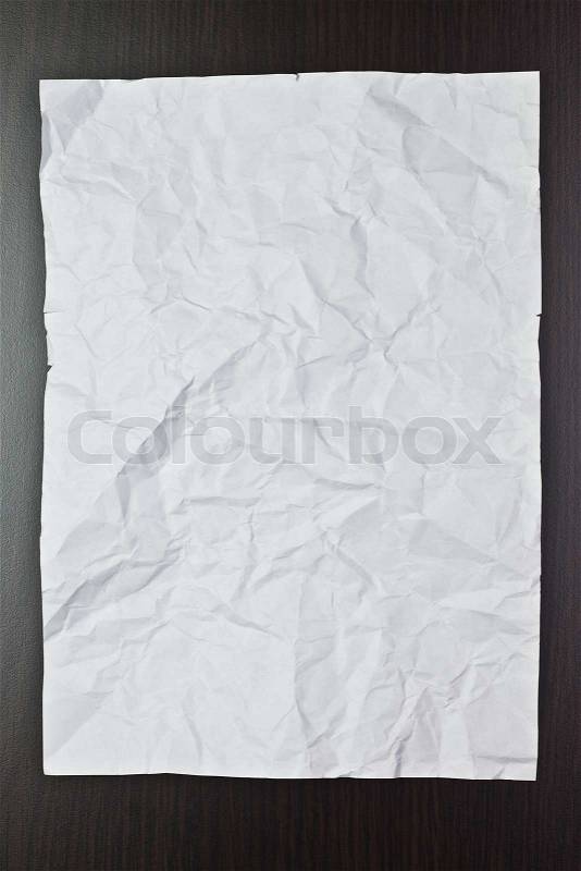 Jammed blank sheet of paper on the table, stock photo