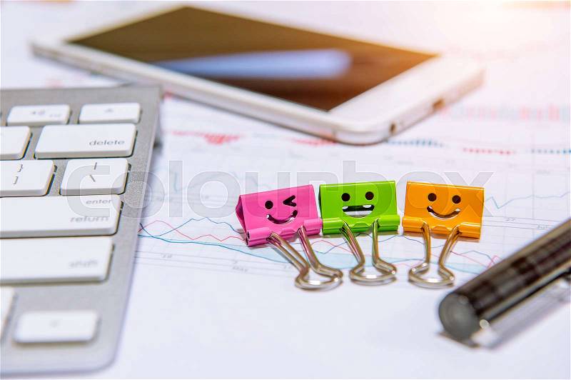 Smile paper clips, keyboard, pen, tablet and documents, stock photo