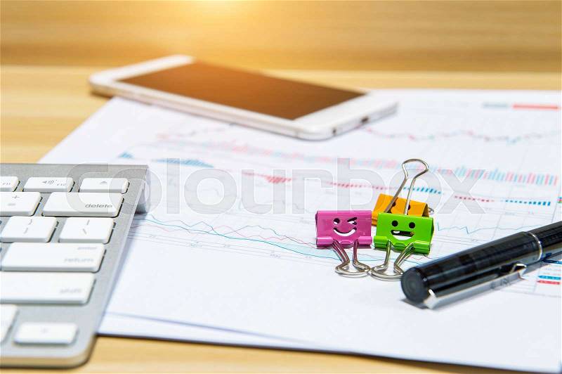 Smile paper clips, keyboard, pen, tablet and documents, stock photo