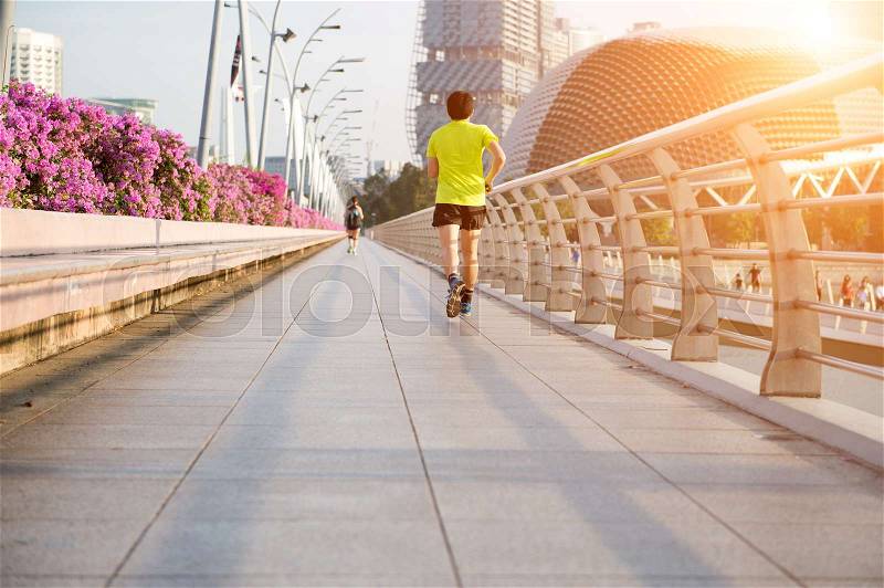 Young man is jogging on road. exercise concept, stock photo