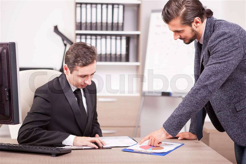 Young Businessmans in formal suits working in office. Teamwok and meetings. Professional communication, stock photo