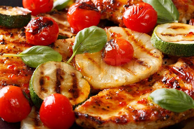 Chicken fillet grilled with pineapple and vegetables macro. background horizontal , stock photo