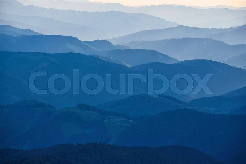 Carpathian mountains summer sunset landscape with abstract gradient of mountain peaks in blue colors, natural travel outdoor background, stock photo