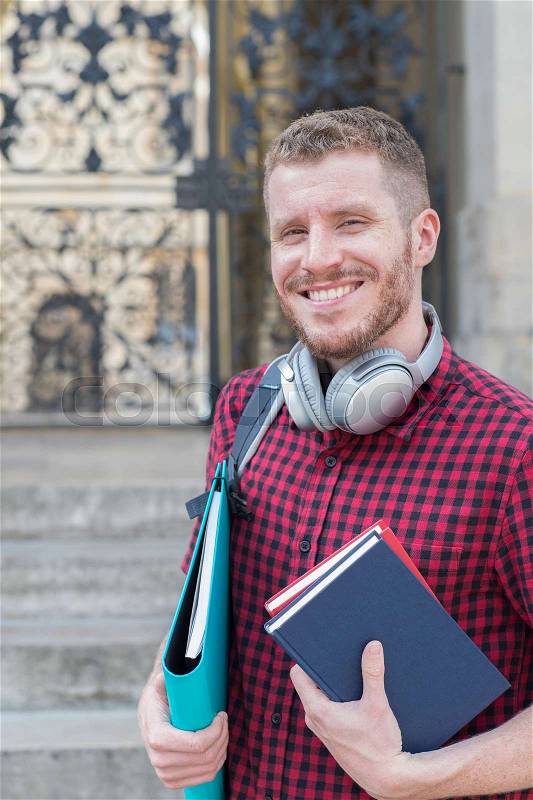 Portrait Of Male University Student Standing Outside Building, stock photo