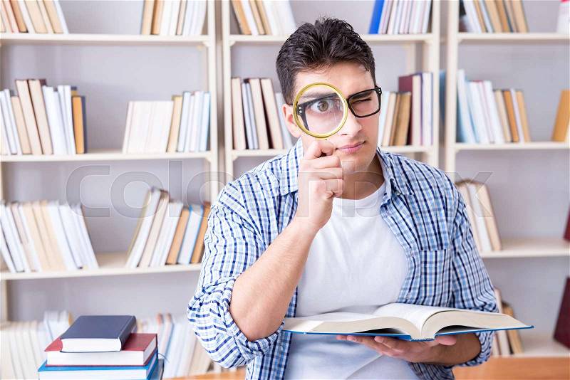 Young student with books preparing for exams, stock photo