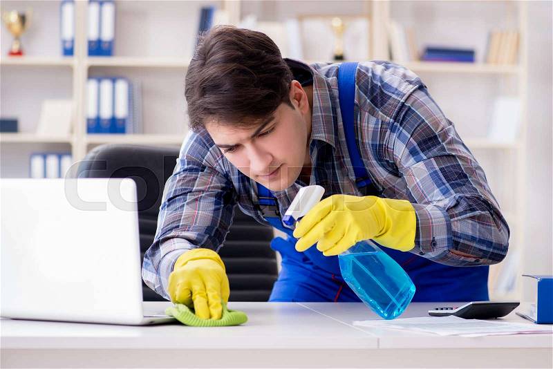 Cleaner man cleaning the office, stock photo