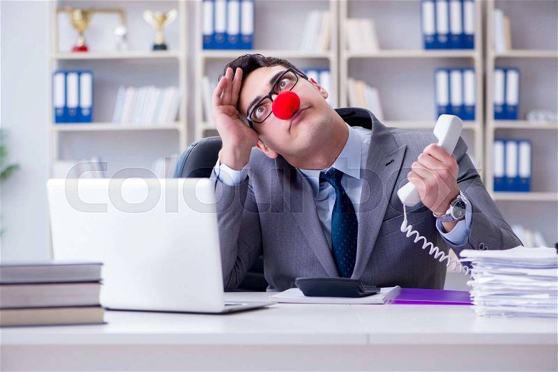 Clown businessman angry frustrated working in the office, stock photo