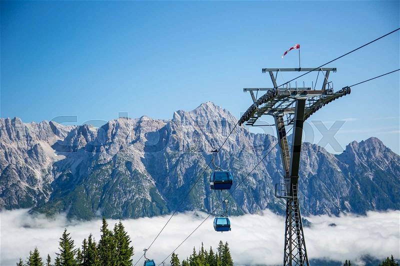 Ski lift or cable way summer season morning mist in the Austrian Alps - Salzburg, Leogang, stock photo