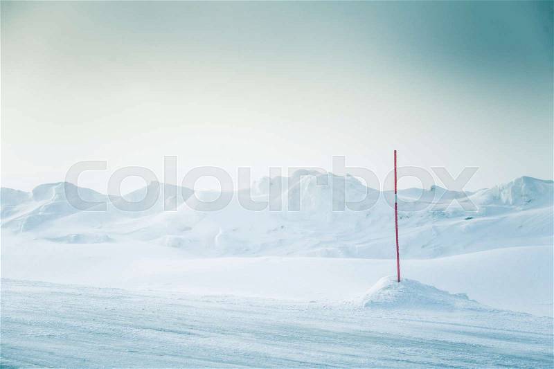 A beautiful, minimalist landscape of snowy Norwegian hills. Clean, light, high key, decorative look, stock photo