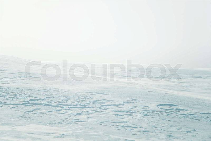 A beautiful, minimalist landscape of flat, snowy Norwegian field. Clean, light, high key, decorative look, stock photo