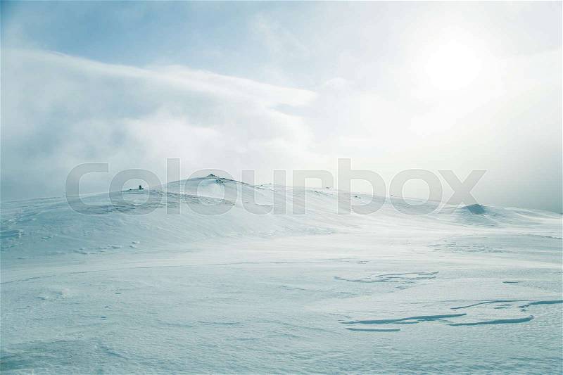 A beautiful, minimalist landscape of flat, snowy Norwegian field. Clean, light, high key, decorative look, stock photo