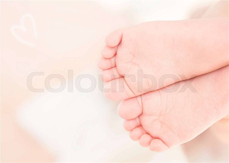 Closeup photo of a cute little baby feet, health care, massage for newborn child, new life concept, stock photo