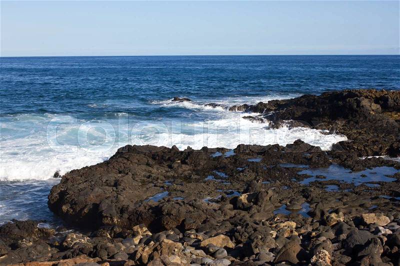 Panoramic ocean view. Volcano, black rocks. Sand macro. Sea background. Horizon Fuerteventura Canary islands, stock photo