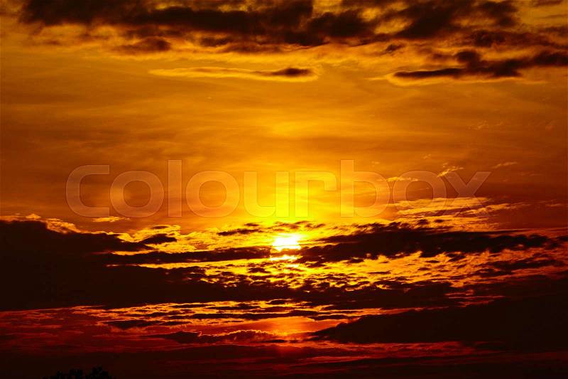 Colorful dramatic sky with cloud at sunset. Golden sky background, stock photo