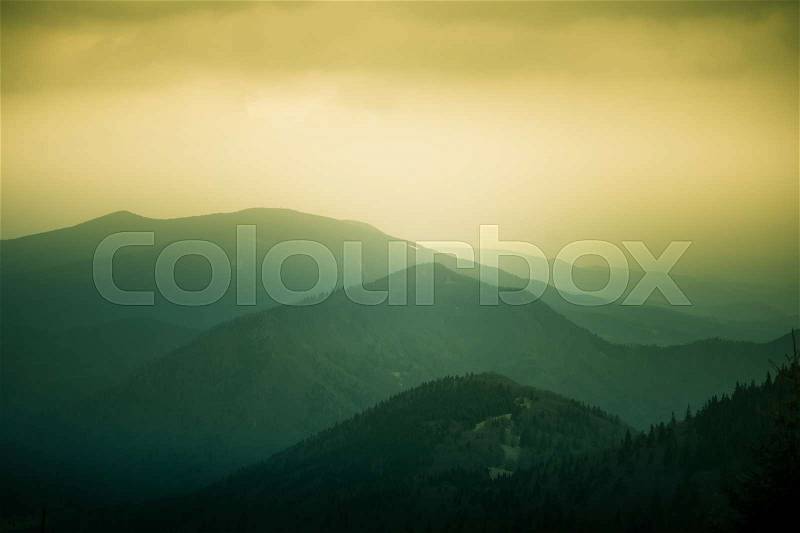 A beautiful, colorful, abstract mountain landscape with a warm green summer haze. Decorative, artistic look. Mala Fatra mountains in Slovakia, stock photo