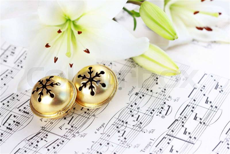 Christmas still life with jingle bells and music notes, stock photo