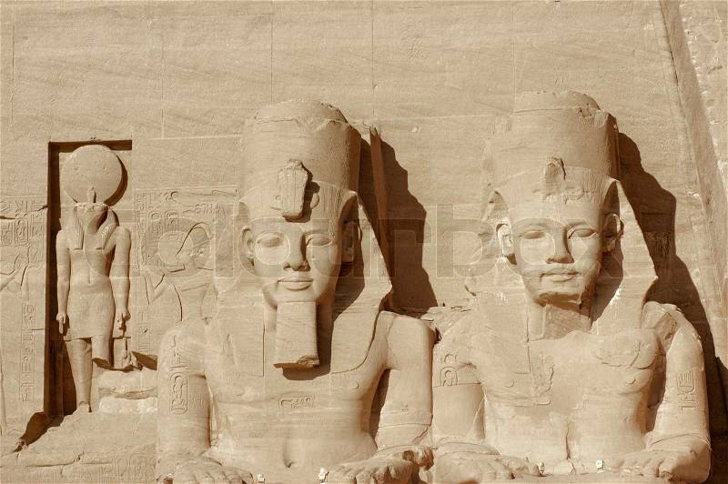 Architectural detail of the historic Abu Simbel temples in Egypt Africa showing some ancient sculptures made of stone, stock photo
