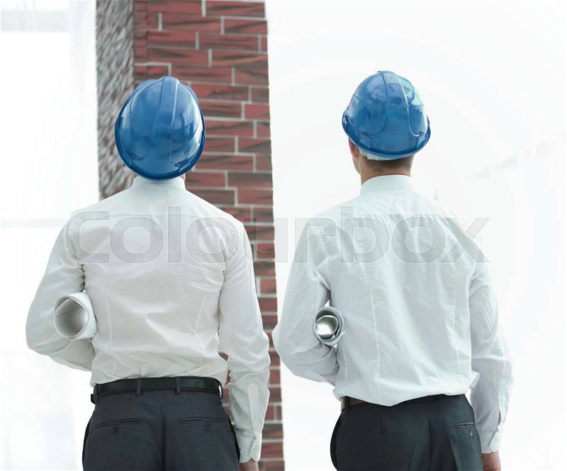 Business background. architect and Builder looking at a building, stock photo