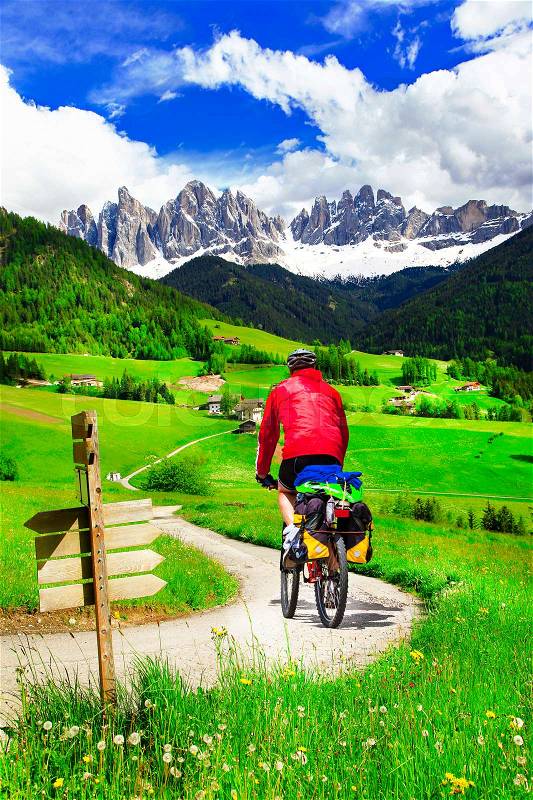 Cycling in Dolomites mountains, outdoor sport activiies, stock photo