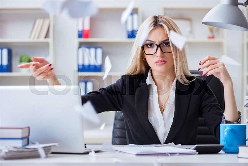 Busineswoman frustrated working in the office, stock photo