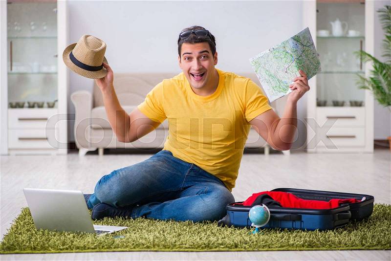 Man planning his vacation trip with map, stock photo