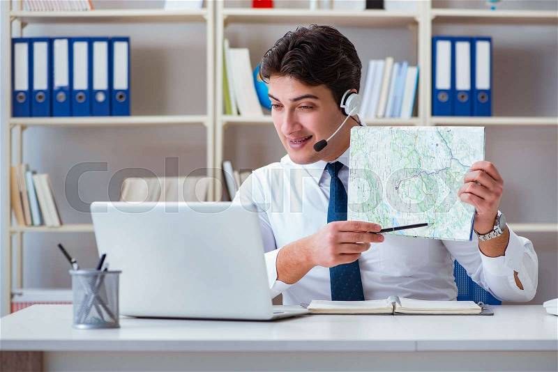 Businessman operator traveling agent working in the office, stock photo