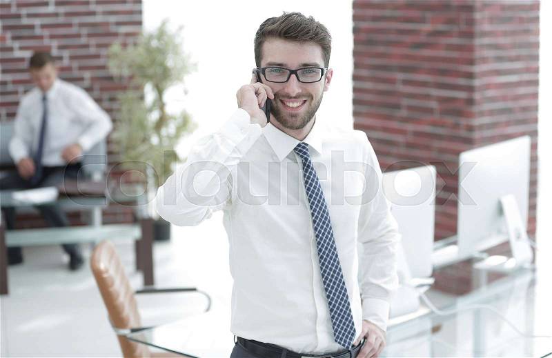 Experienced lawyer advises a client on a mobile phone, stock photo