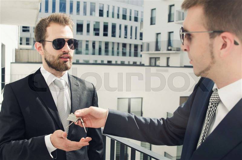 Young businessman investor buying new apartment. estate real agent property home investor young keys concept, stock photo
