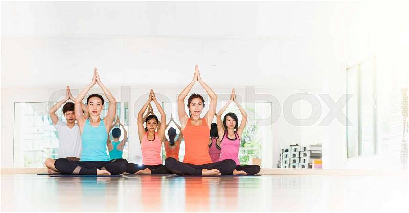 Yoga class in studio room,Group of people doing tree pose with clam relax emotion,Meditation pose,Wellness and Healthy Lifestyle,Leave copy space for adding text,banner size, stock photo