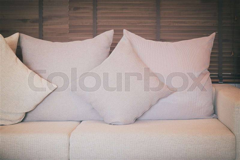 Beige color sofa set in the living room with vintage style effect, stock photo