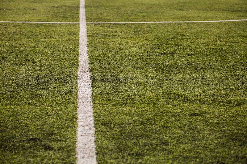 Green grass pattern for football sport, Football field, soccer field, team sport texture. White stripe on it. Close up focus, stock photo