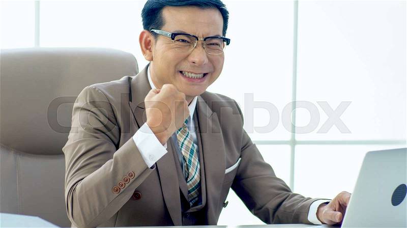 The Excutive Businessman Hands up gets excited when finally success, smooth movement, concept business success, stock photo