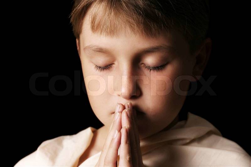 Child in prayer - softness added, stock photo