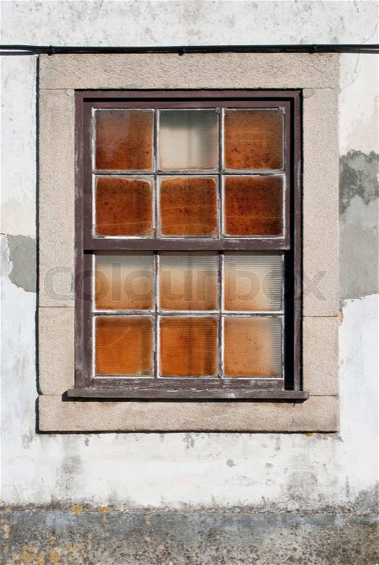 A closed old window with dirty glass, stock photo