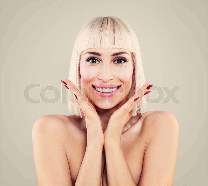 Portrait of Happy Surprised Woman with Pretty Smile. Smiling Model with Makeup, Manicure, Blonde Hair , stock photo