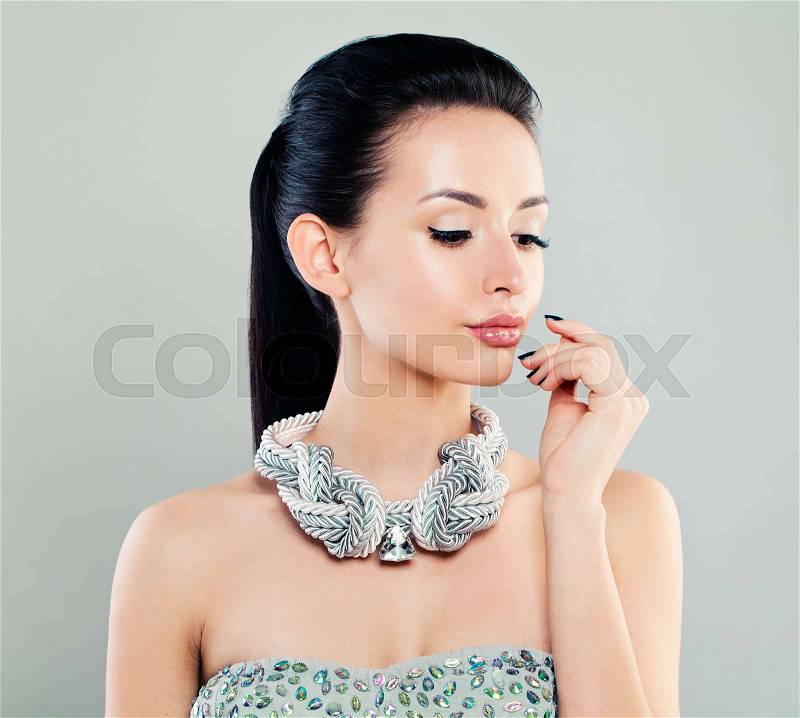 Fashion Portrait of Beautiful Woman Model in Silver Cloth, stock photo