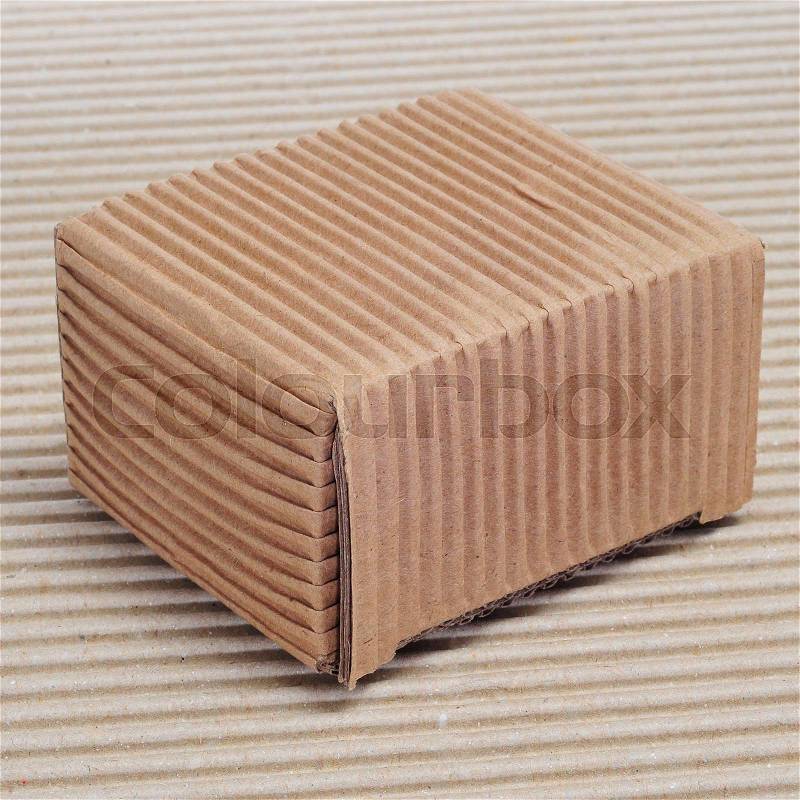 A corrugated cardboard box on a corrugated cardboard background, stock photo