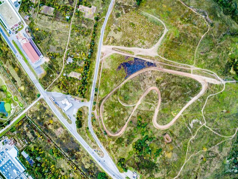 Motor and auto tracks in suburb field, top view, aerial photo, stock photo
